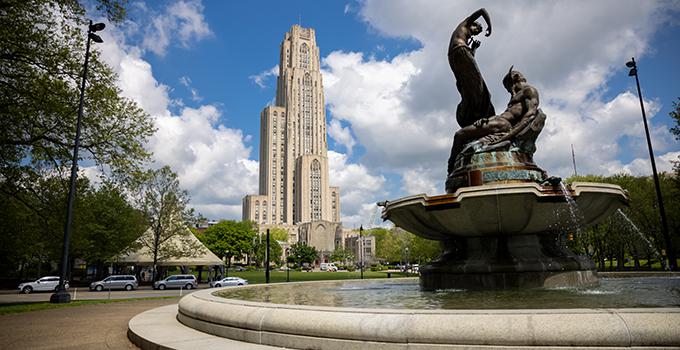 Frick Art fountain with cathedral of learning in background